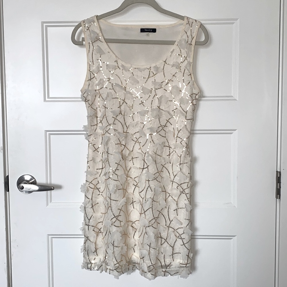 Cream dress with cream ruffled flowers and gold sequence. Size Medium.